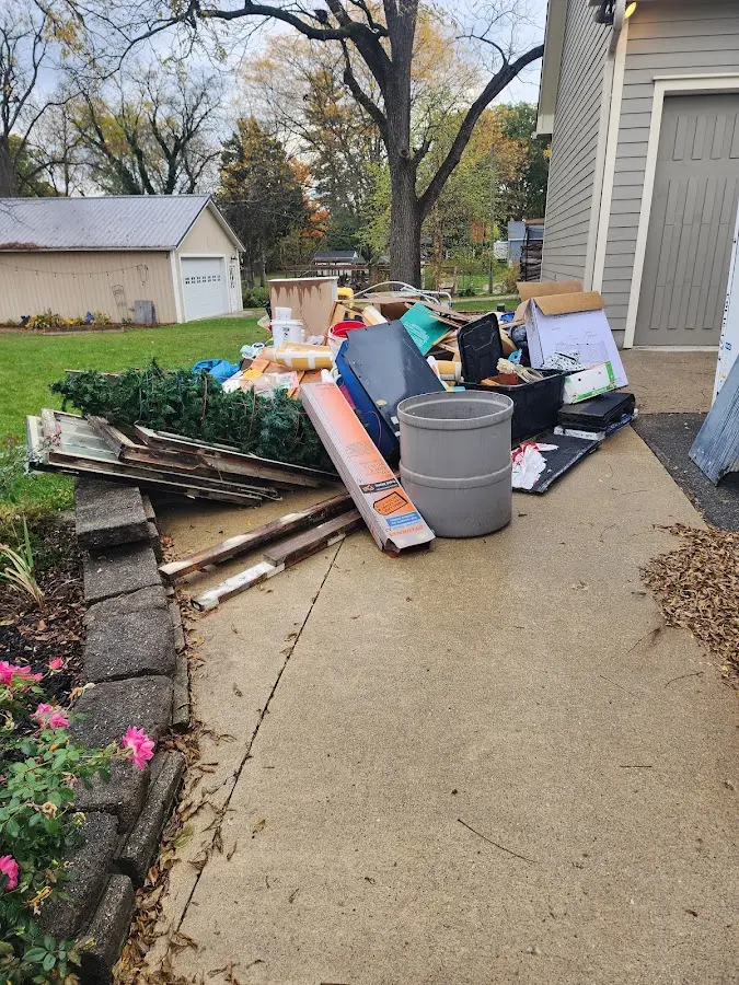 Dumpster being loaded with debris for Estate Cleanout Dumpster Rental in Atherton